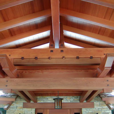 The ceiling in a Craftsman style home uses custom-shaped redwood timbers, wood pegs and many other attractive details.